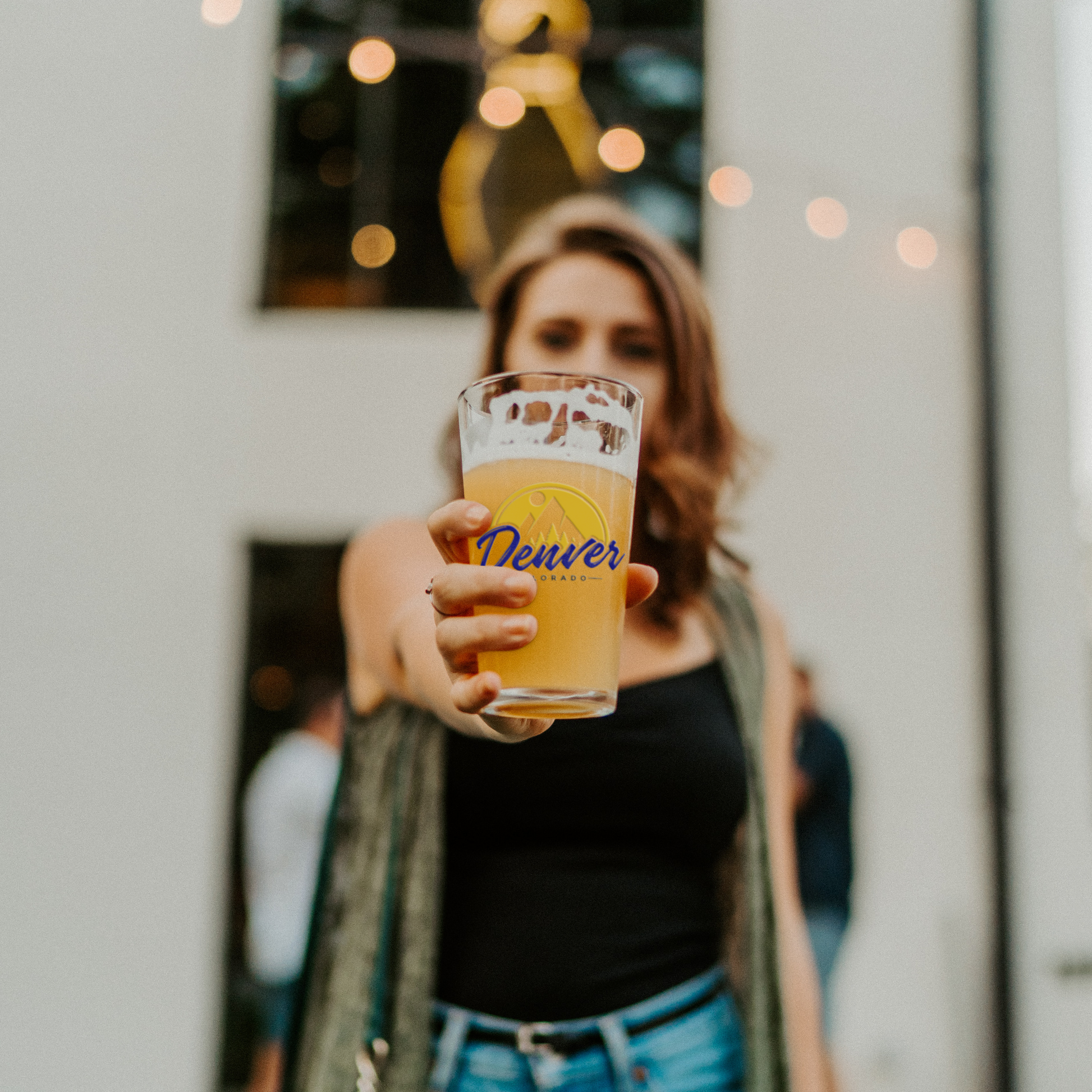 Denver_Colorado_-_16oz_pint_glass_Pint_Glass_Model_Lifestyle_Mockup.png