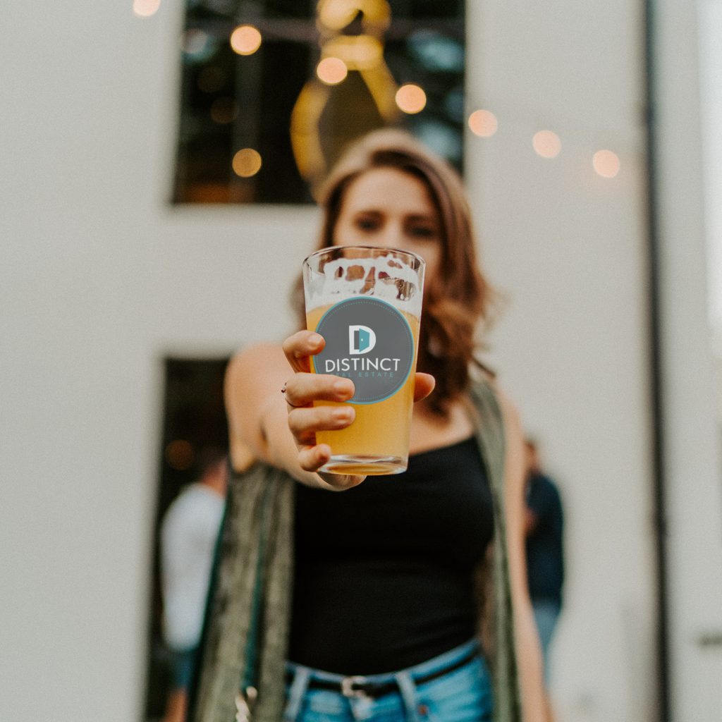 Distinct_Real_Estate_-_16oz_pint_glass_Pint_Glass_Model_Lifestyle_Mockup.png