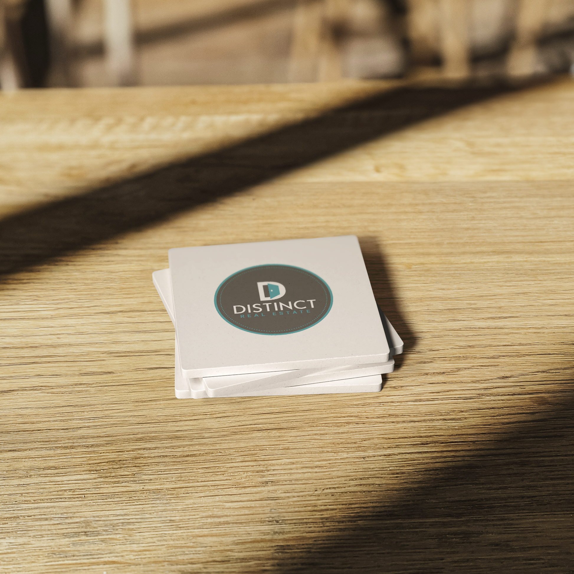 Stone_Coasters_with_circle_logo_SquareStoneCoaster_WoodTable_AS_Mockup.png